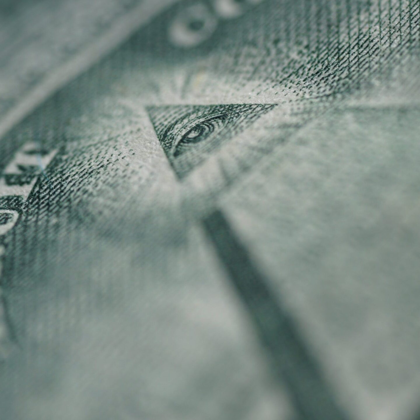 Close-up of the green pyramid on dollar bills
